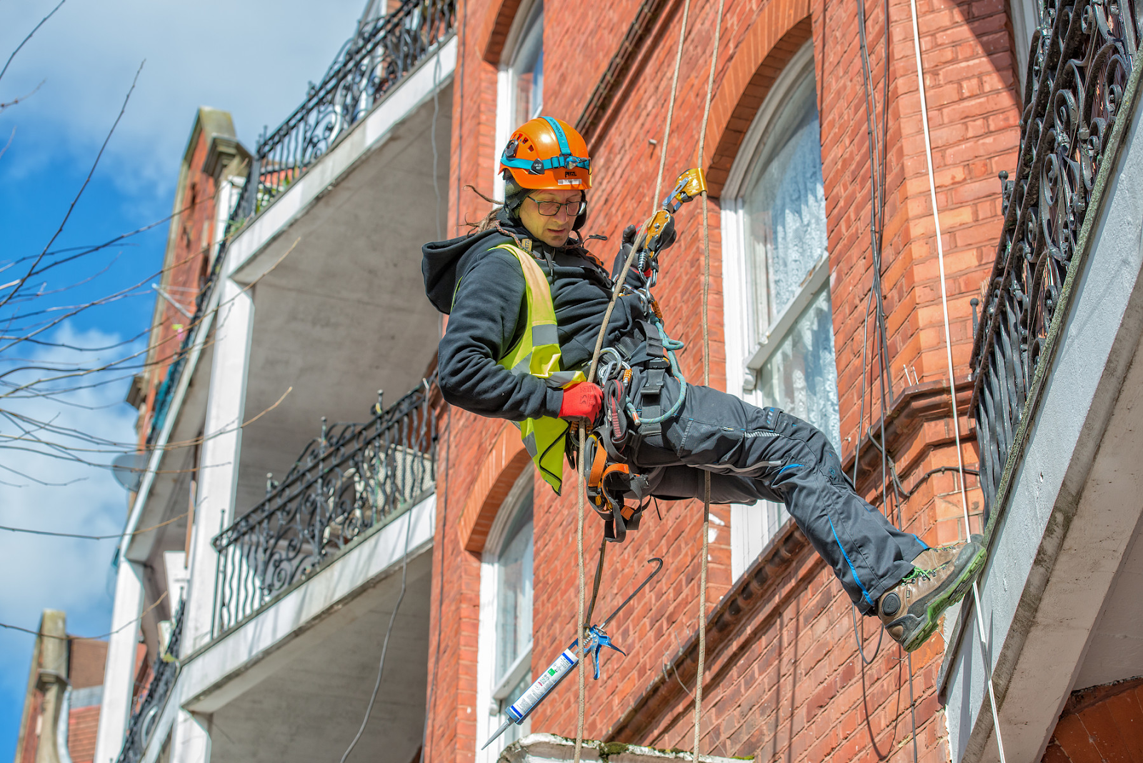 Rope access technician on a building.
